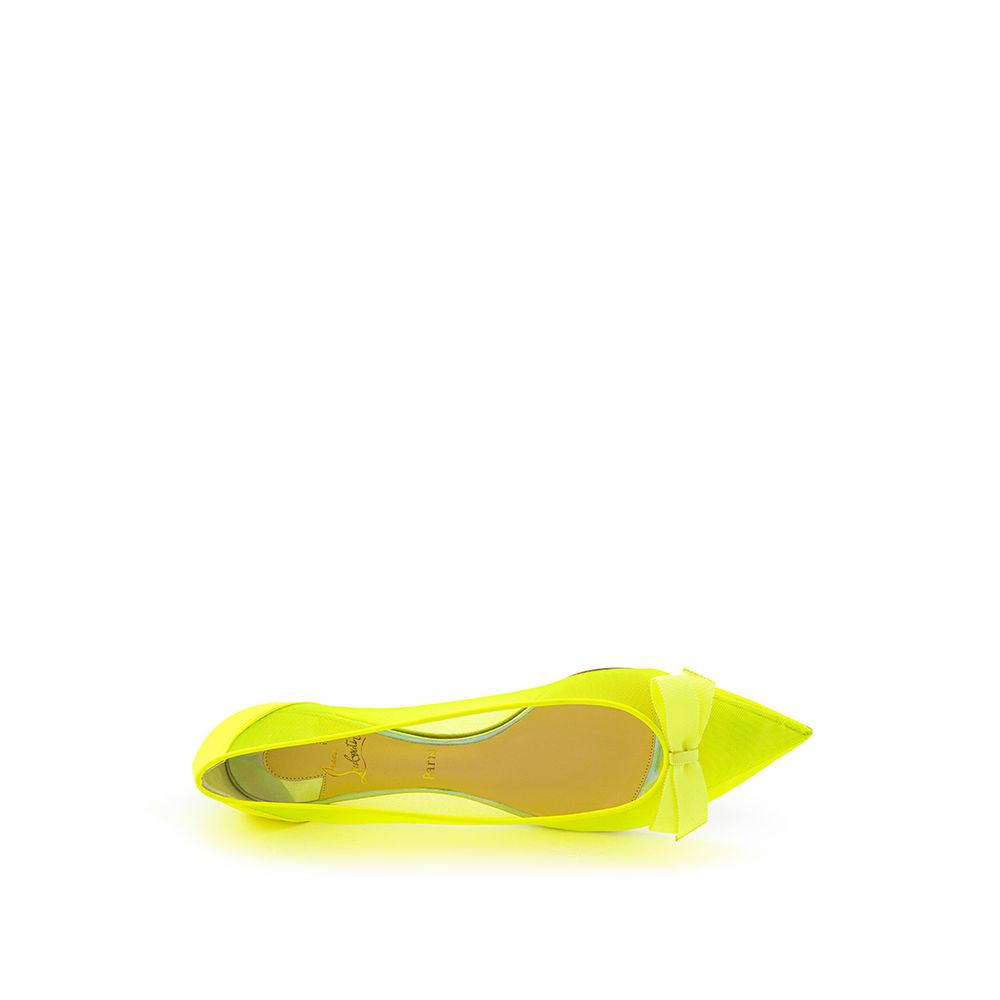 Yellow high heel shoe with a pointed toe and a strap over the foot