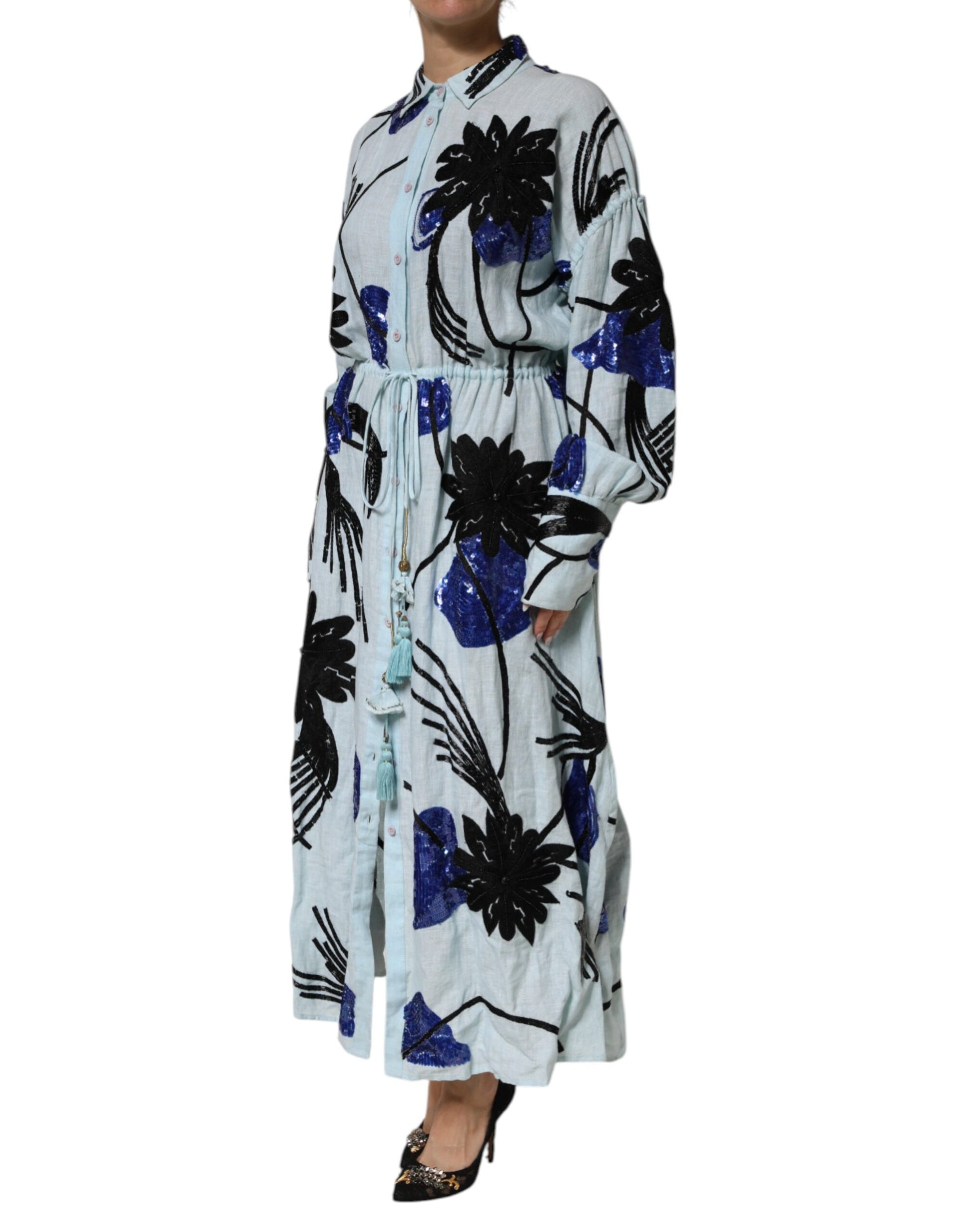 A long blue dress with sequin embellishments and a shirt-like top