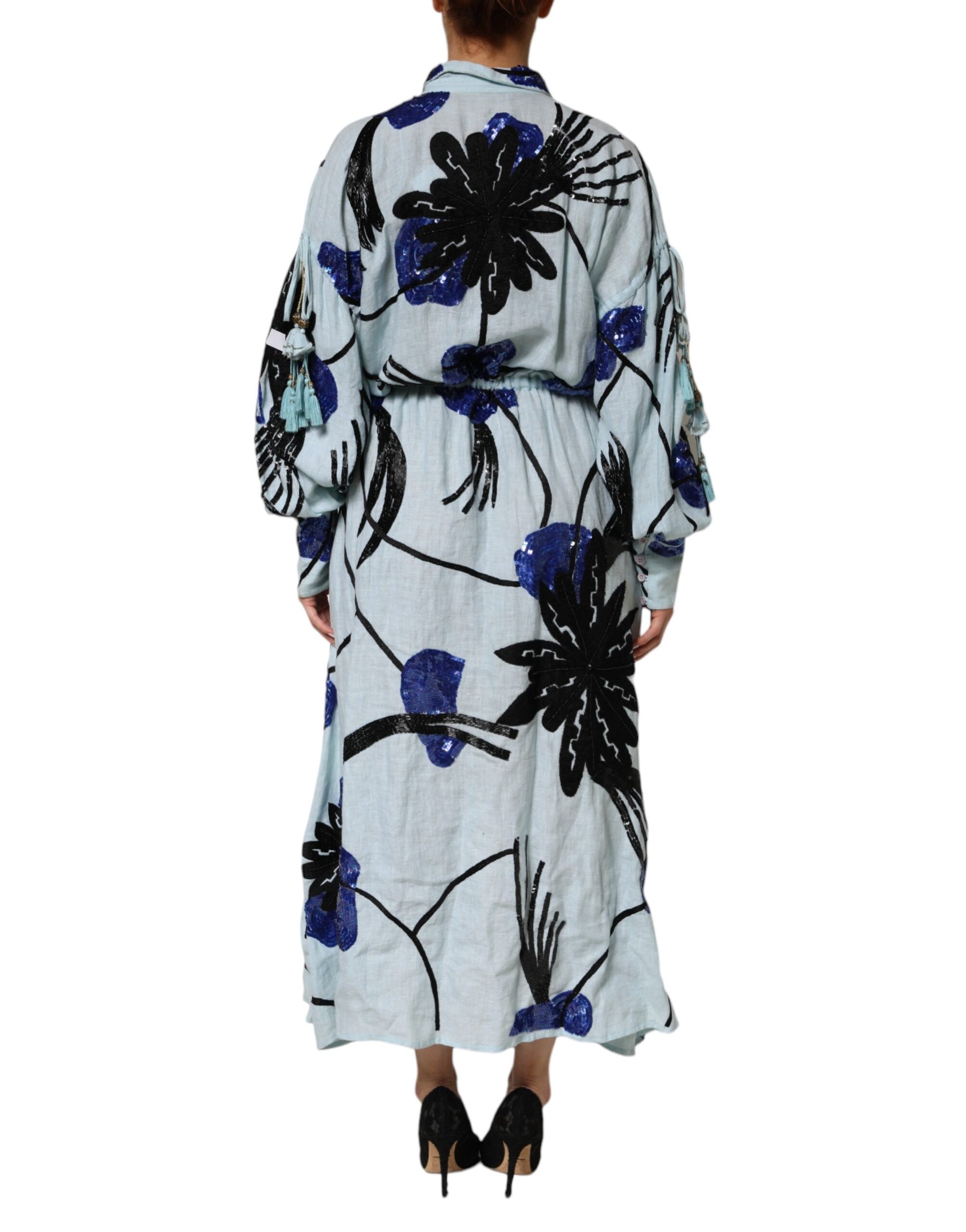 A long blue dress with floral embroidery and sequin details