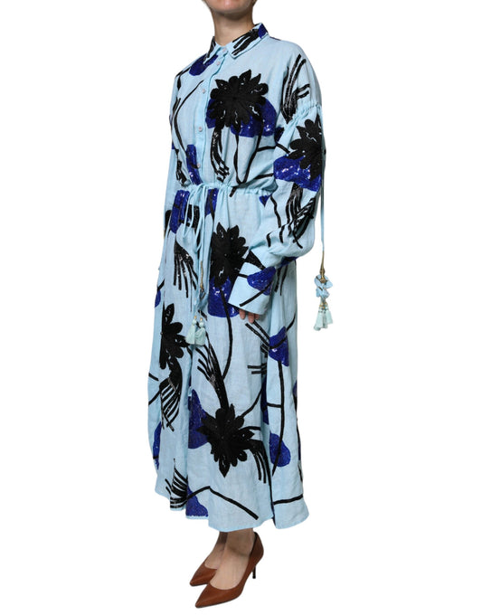 A long blue dress with floral embroidery and beaded details