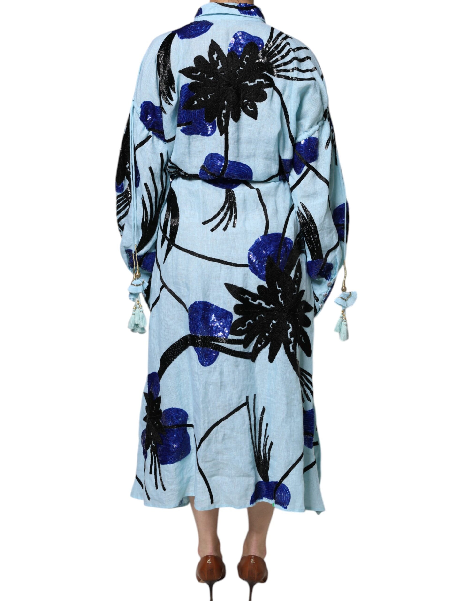 A long blue dress with floral embroidery and sequin details