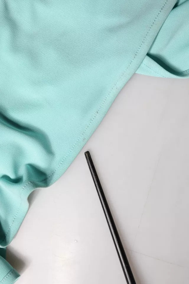 Black pen on white surface next to folded fabric
