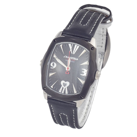 A black leather watch with a silver face featuring roman numerals, hands indicating the time, and a heart-shaped logo on the
