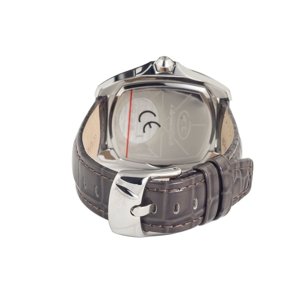 A black leather watch with a silver face and white markings, featuring a chronograph function
