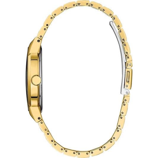 A gold stainless steel watch with a white face, black hands, and a date window