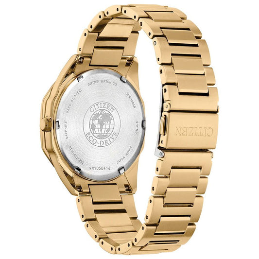 A gold stainless steel watch with a white face, featuring a logo on the dial and a date window