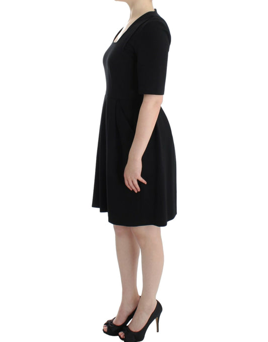 Black dress with short sleeves and a flared skirt
