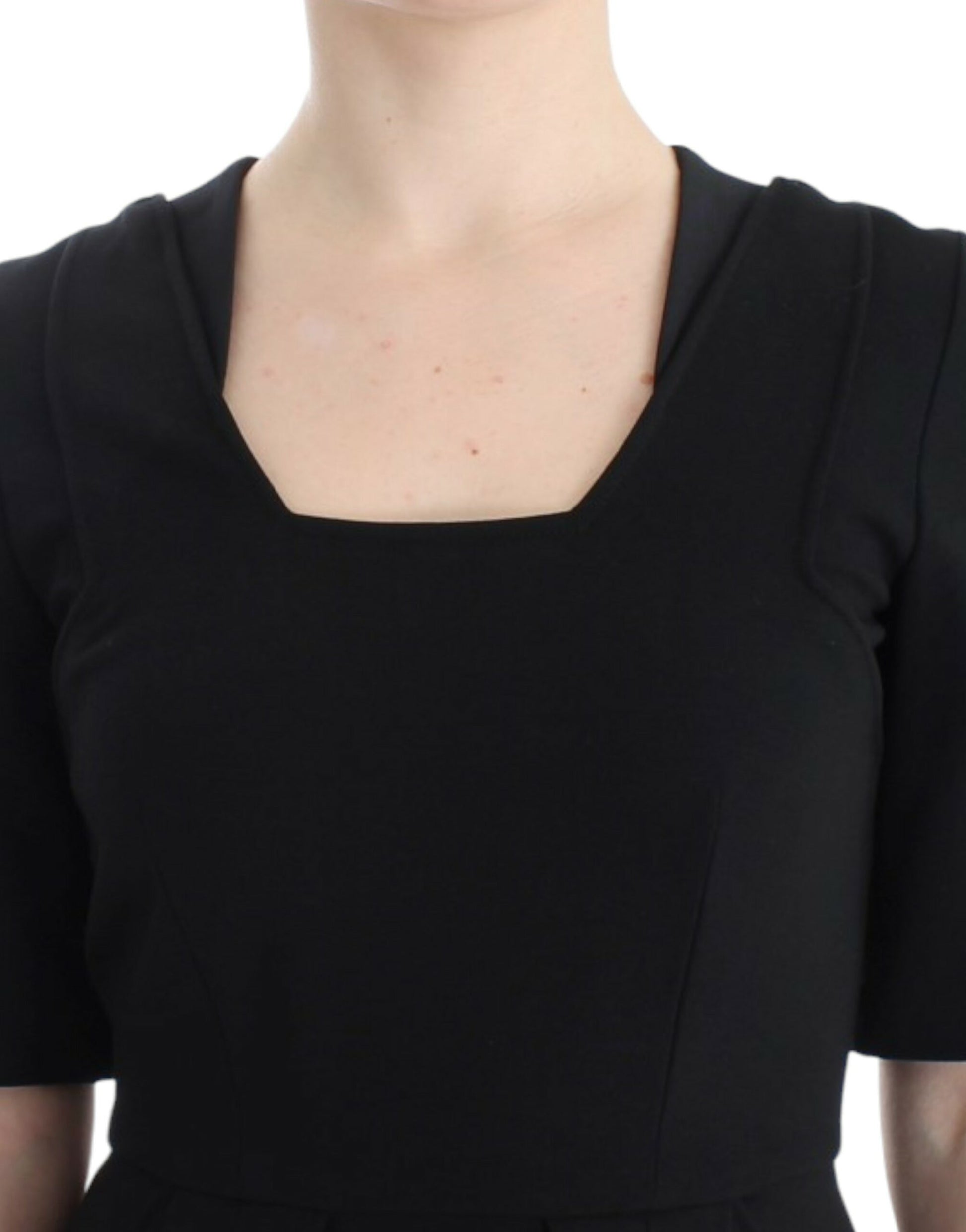 Black sleeveless dress on a woman