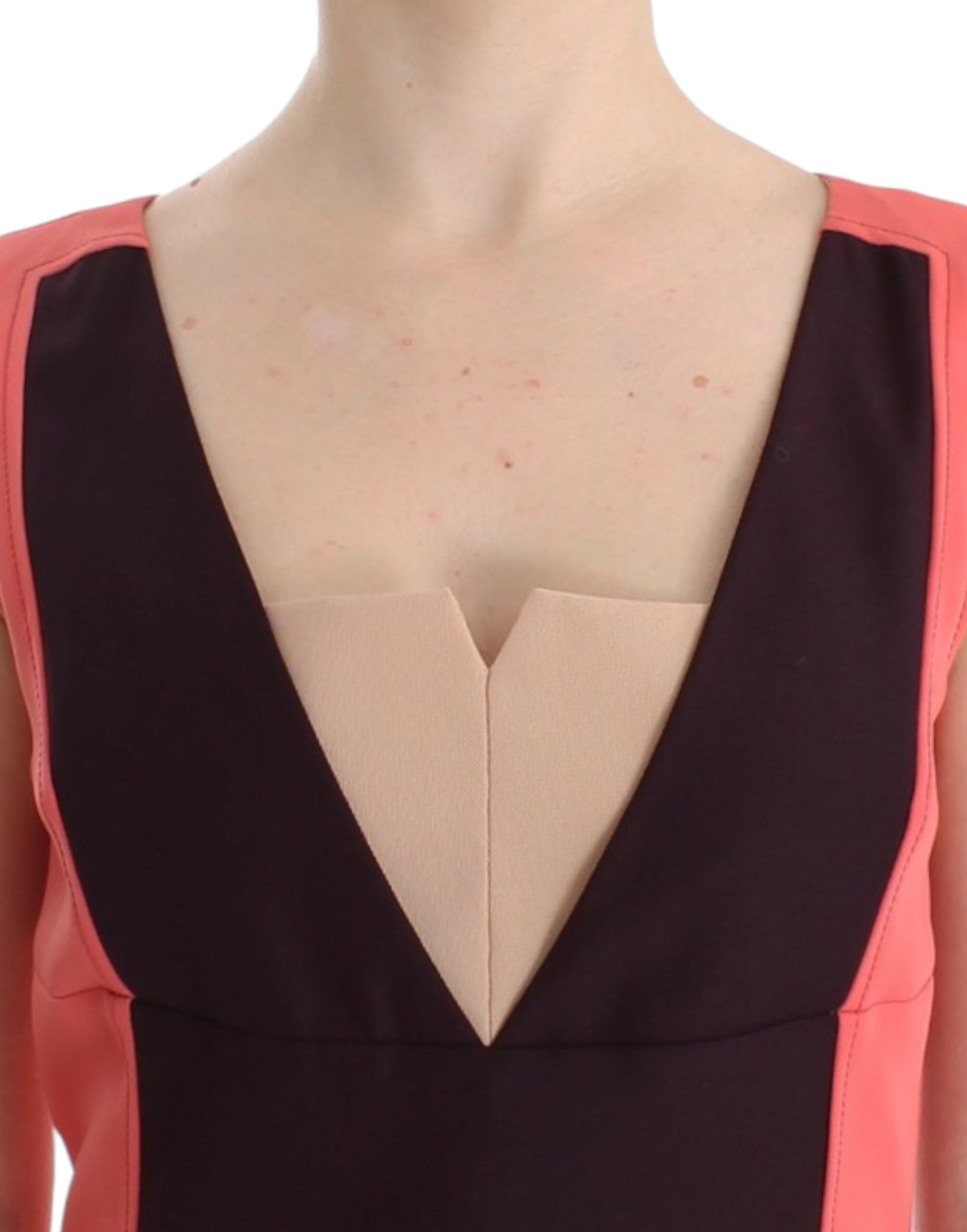 Woman wearing a black and pink dress with a heart-shaped cutout on the chest