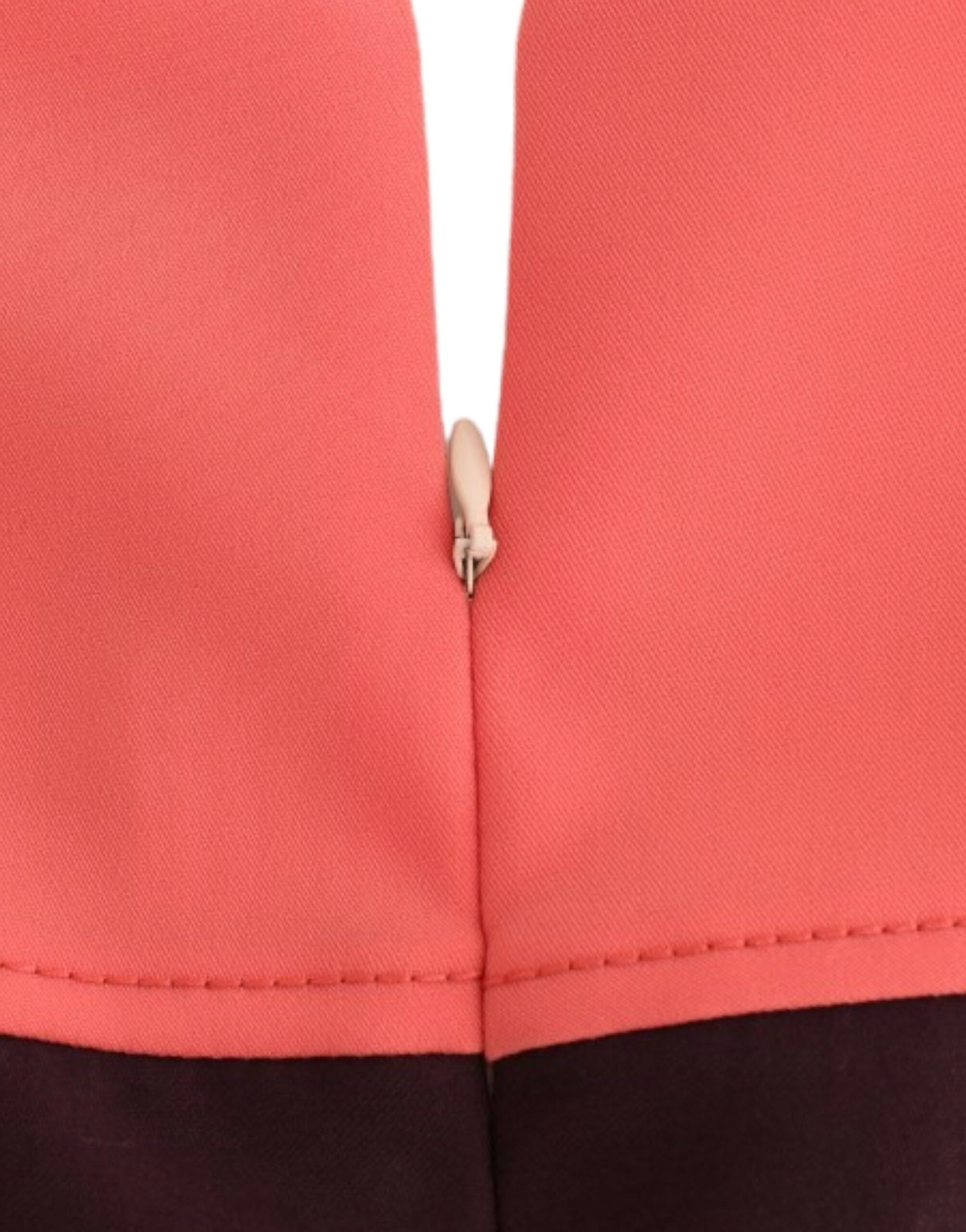 Red athletic shorts with zippered front