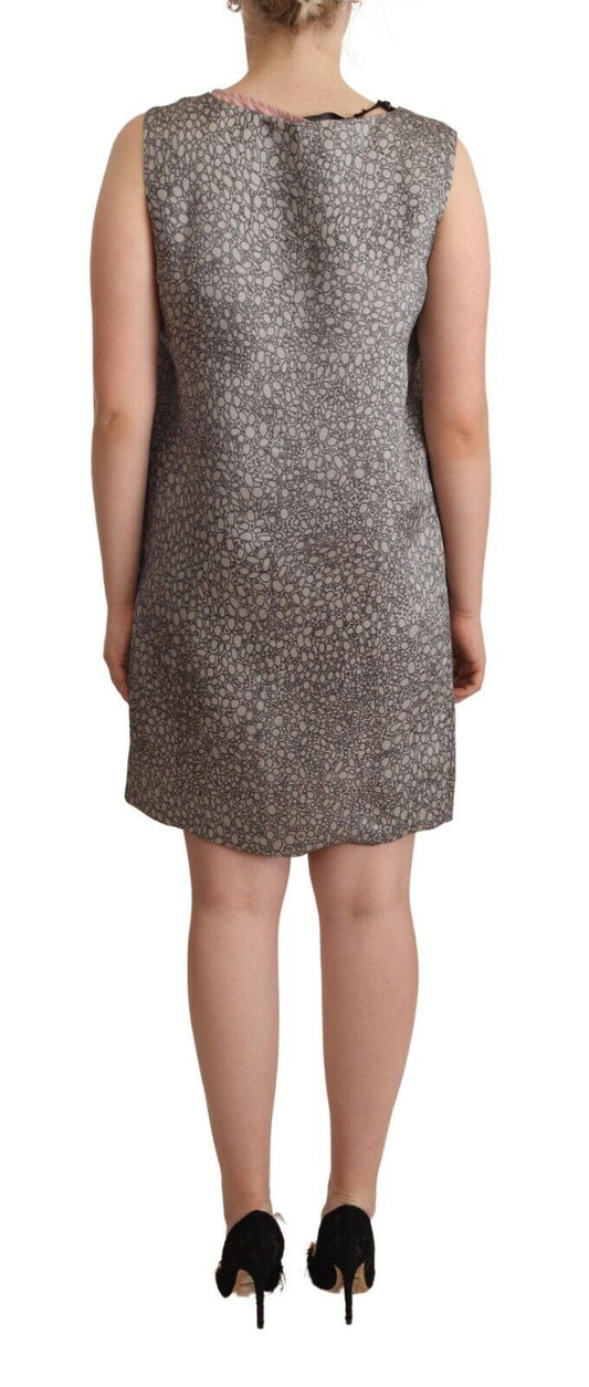 A gray sleeveless shift knee length dress with a leopard print pattern