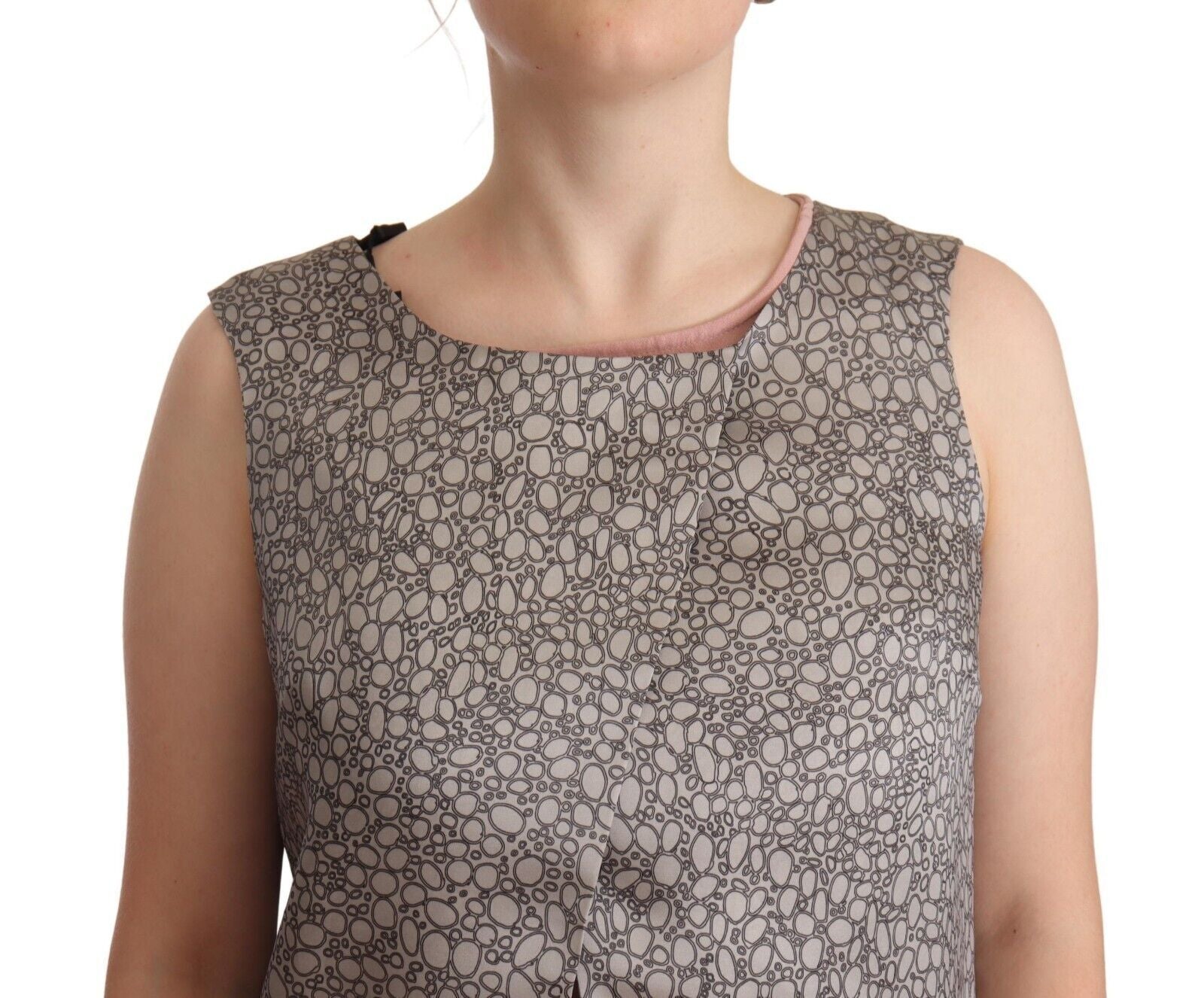 A gray sleeveless shift dress with a floral pattern, knee length