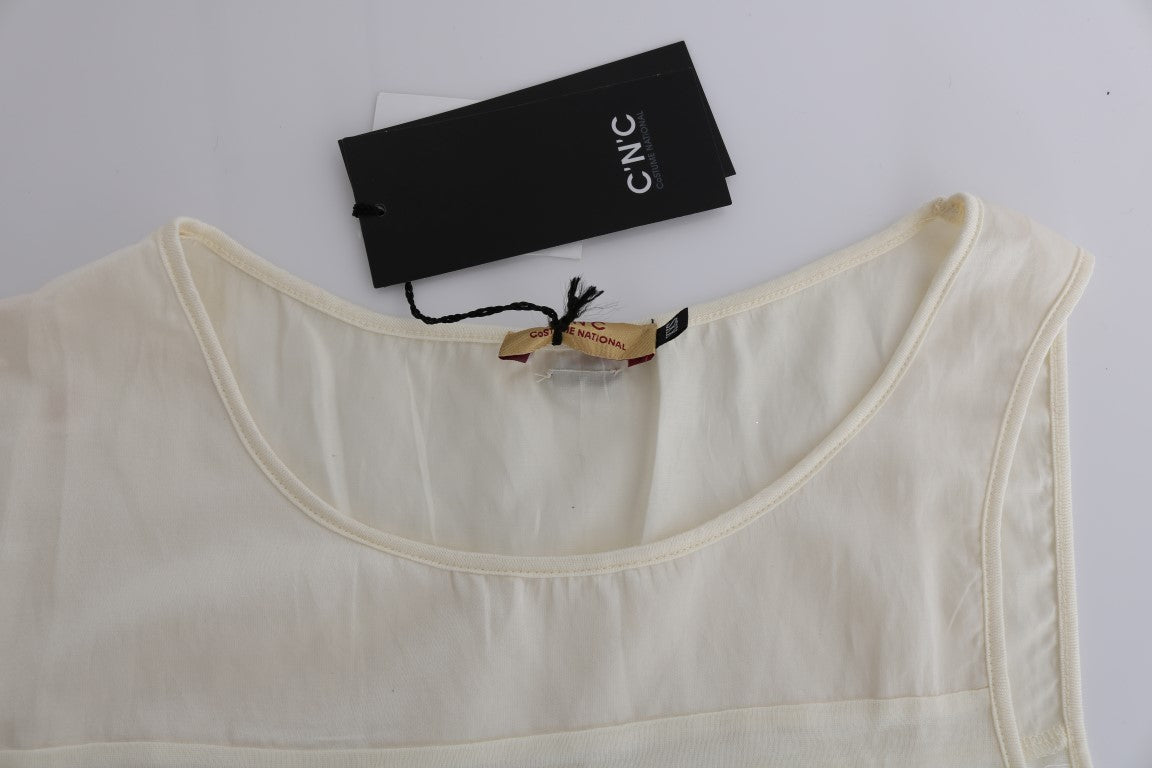 White cotton blouse on hanger with tag