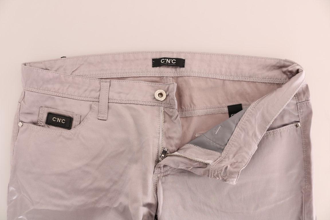 Pair of light pink trousers with zippered pockets