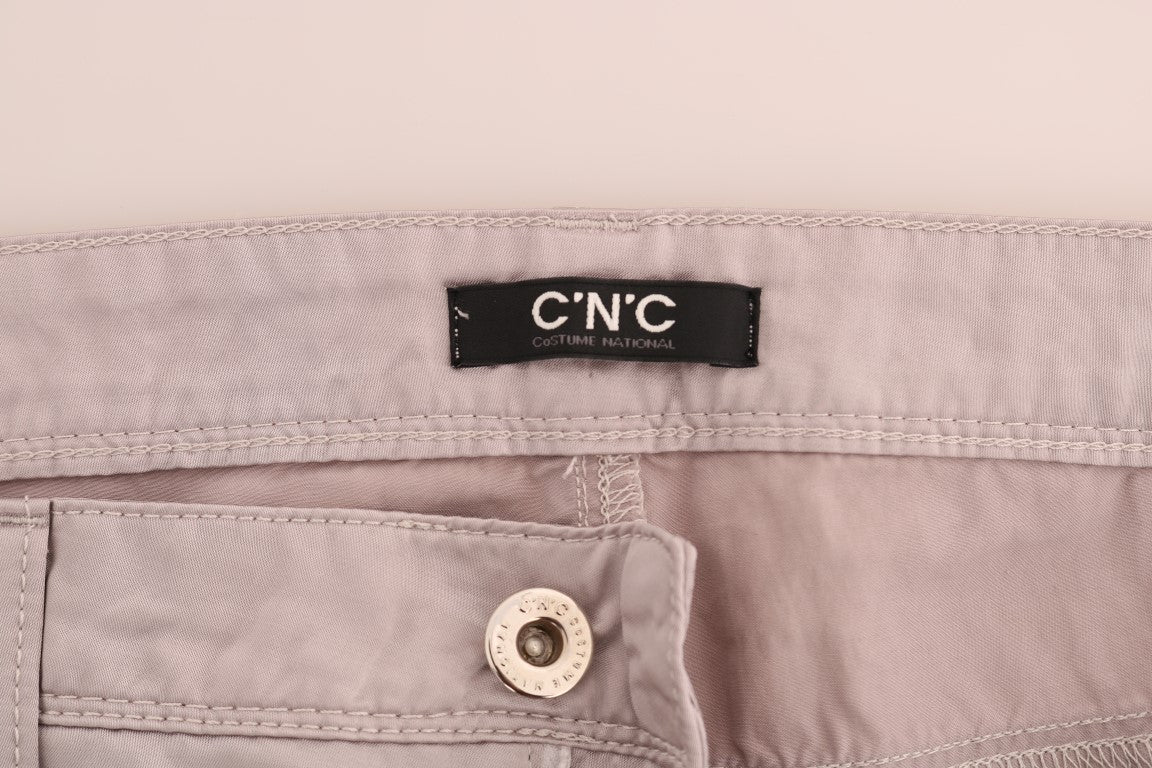Pair of light beige jeans with button closure
