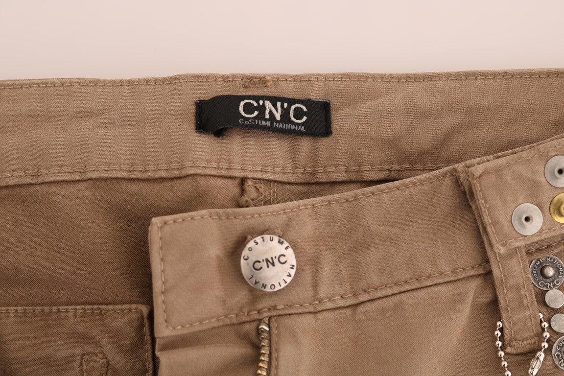 Pair of brown cargo pants with metal buttons on pockets