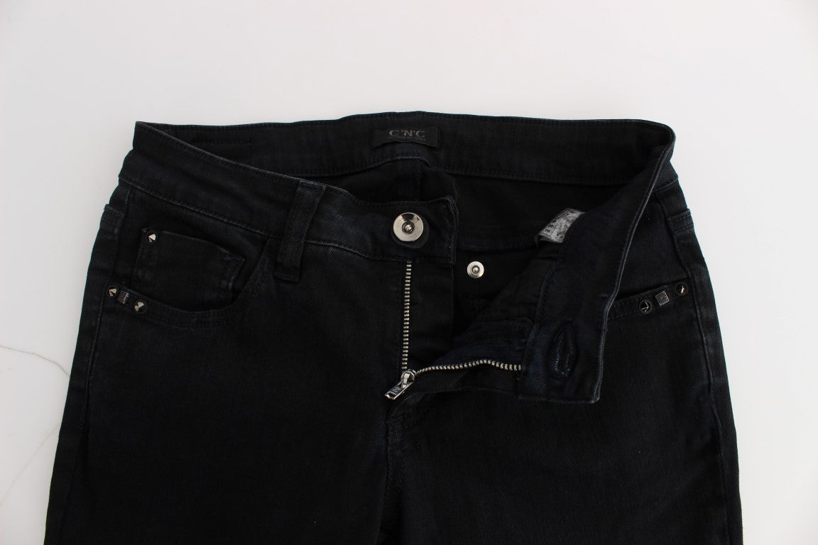 Pair of black denim jeans with zippers on front