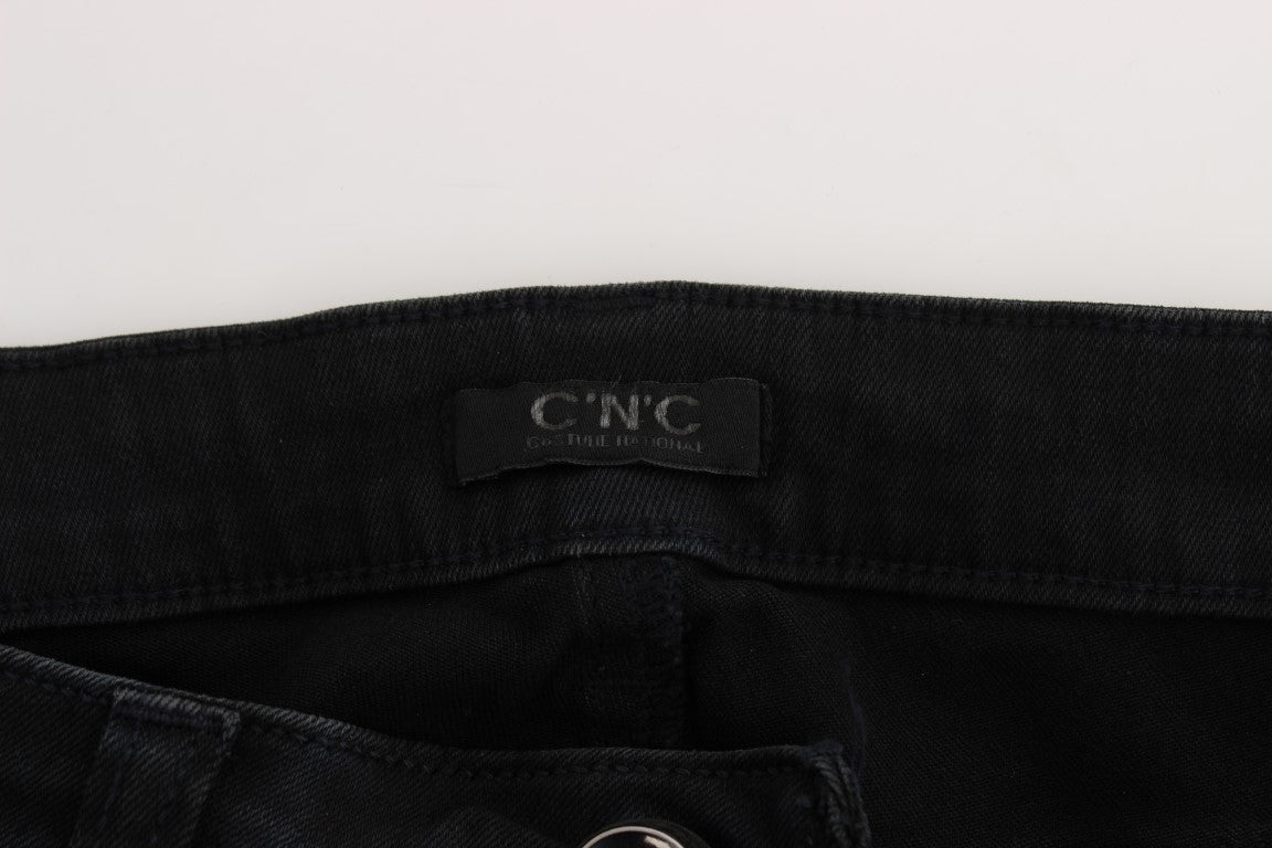 Pair of dark blue jeans with a label on the waistband