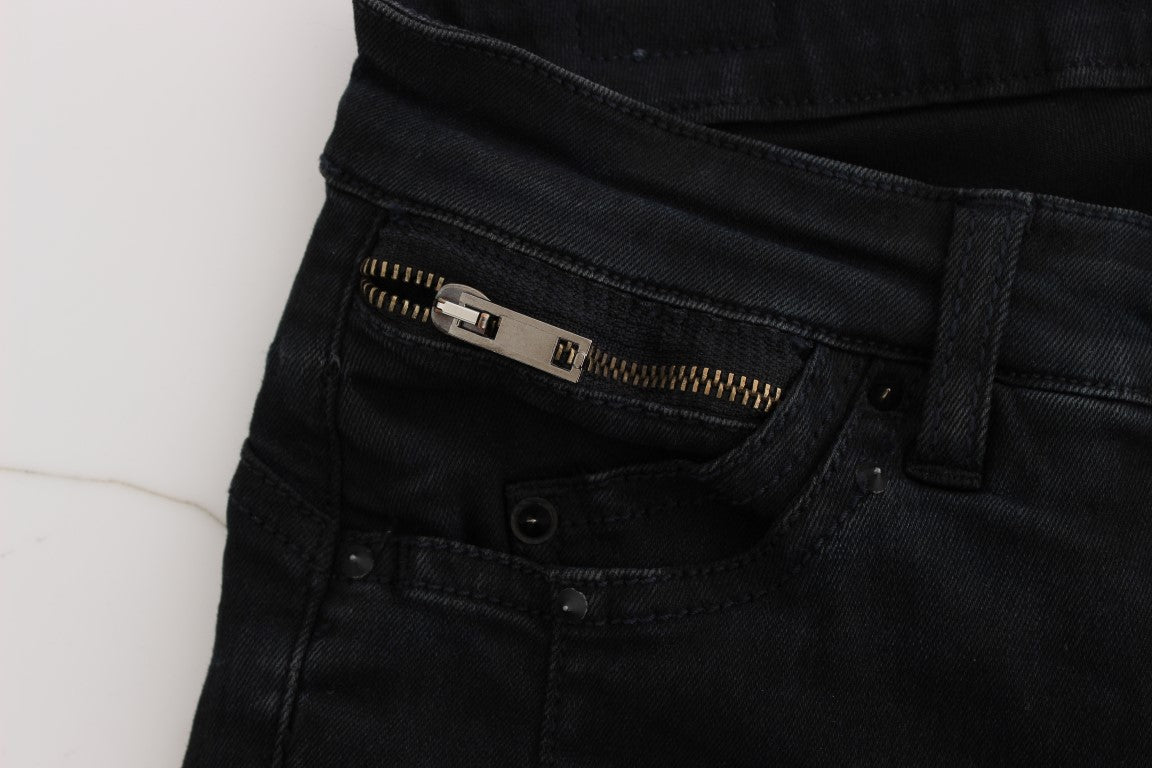 Pair of dark blue jeans with zippered pocket on left leg