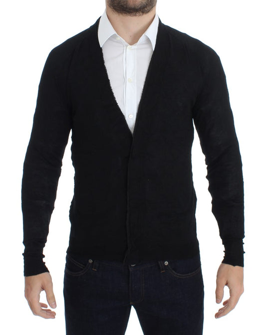 Man wearing a dark sweater vest over a white shirt