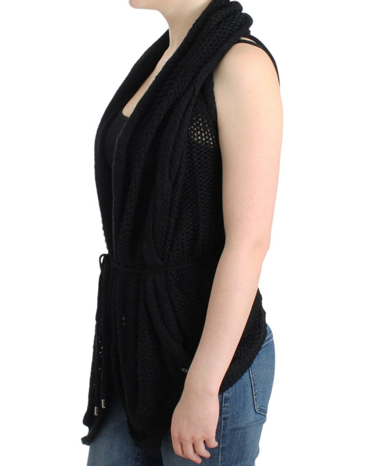 Black knitted vest over black tank top