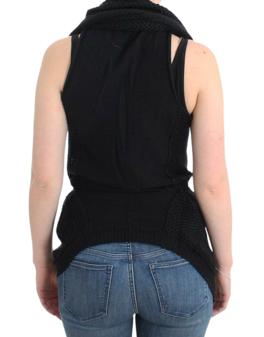 Black knitted vest over blue jeans