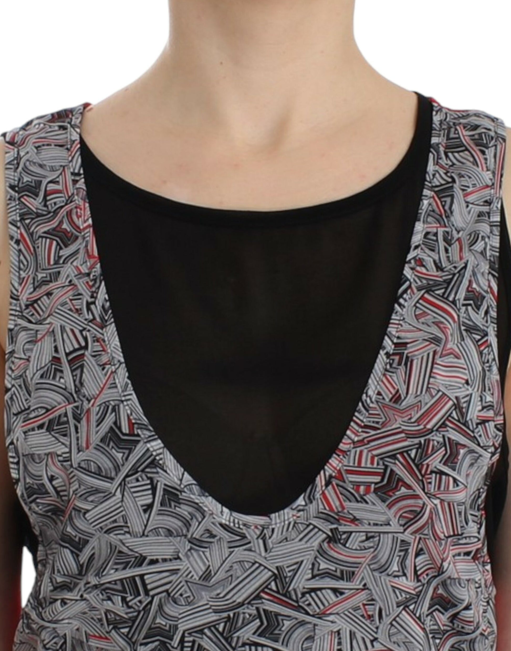 Black and white sleeveless top with a V neckline