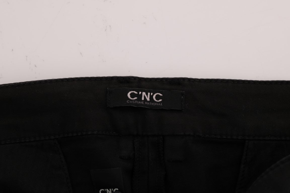 Black pants with a tag on the waistband