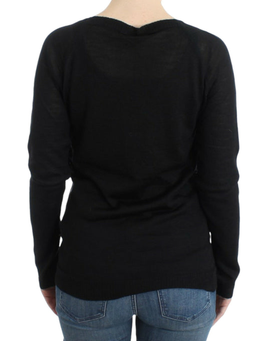 Black long sleeve sweater on a person