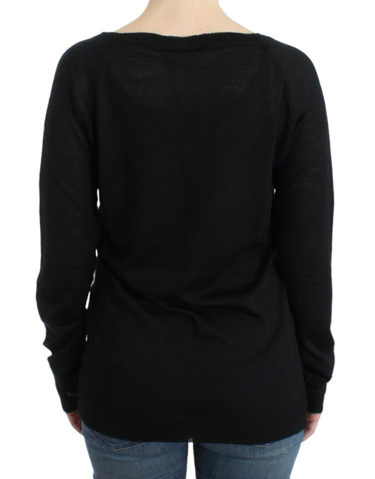 Black long sleeve sweater on a person's back