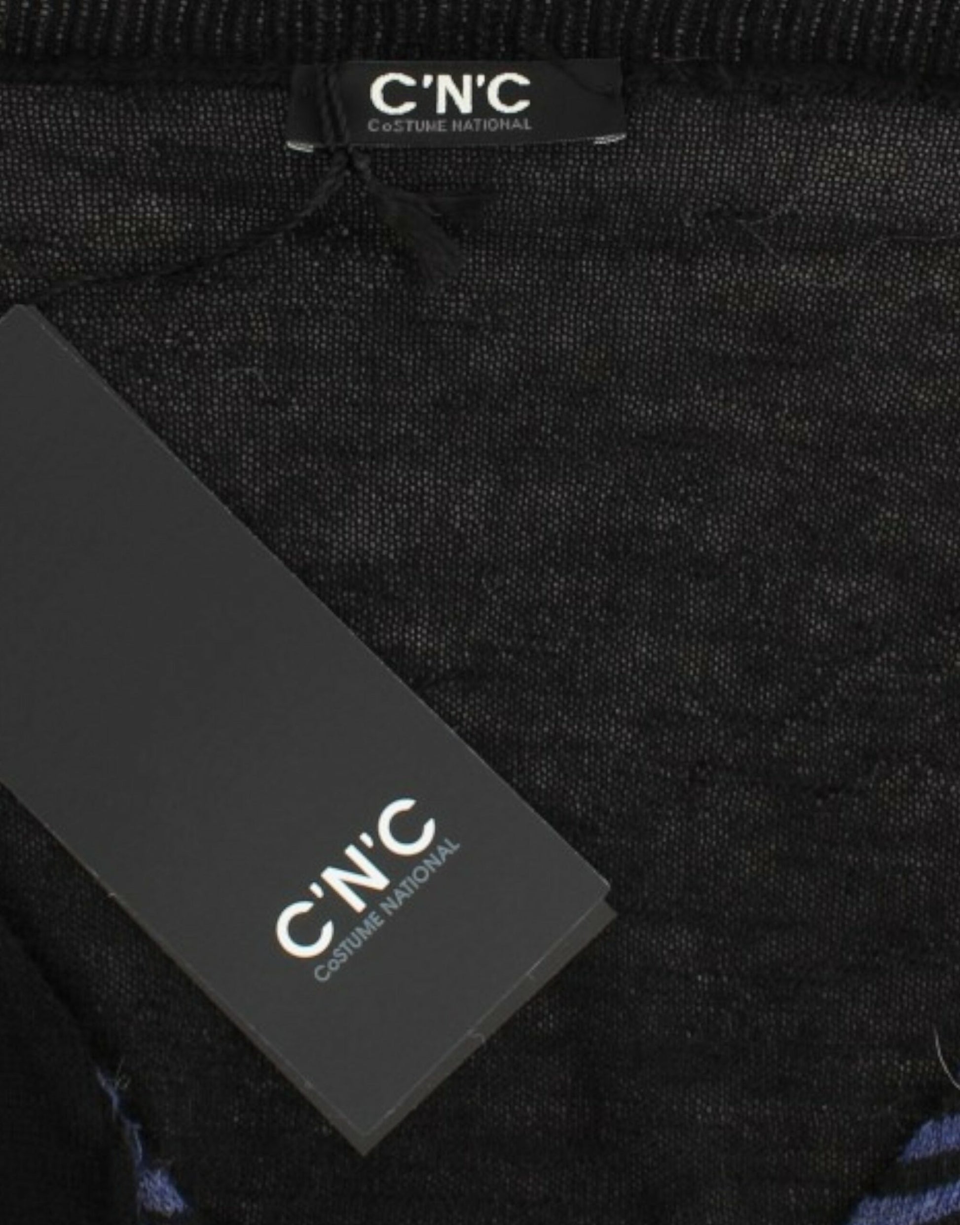 Black fabric tagged with white letters