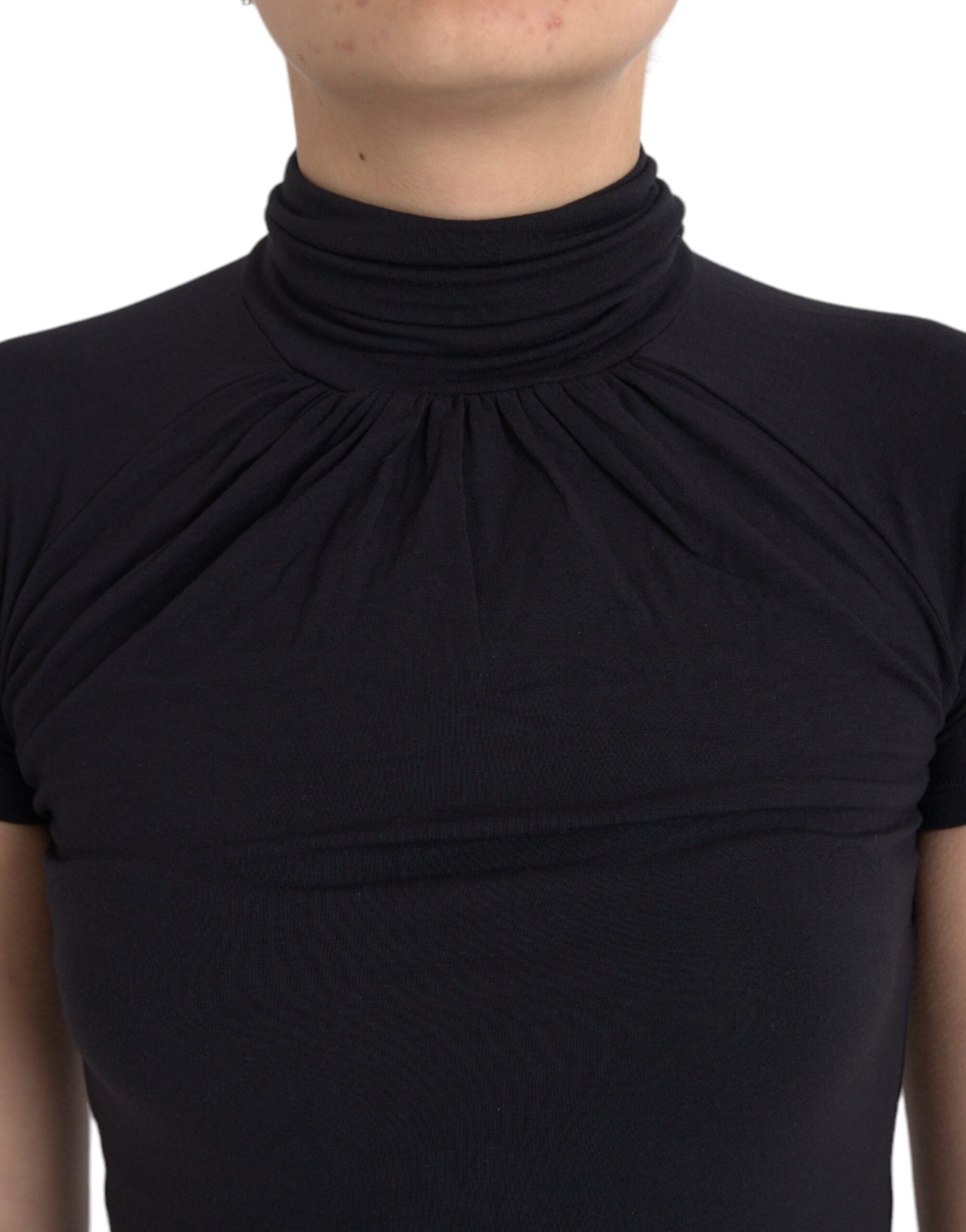 Black turtleneck top with ruffled neckline