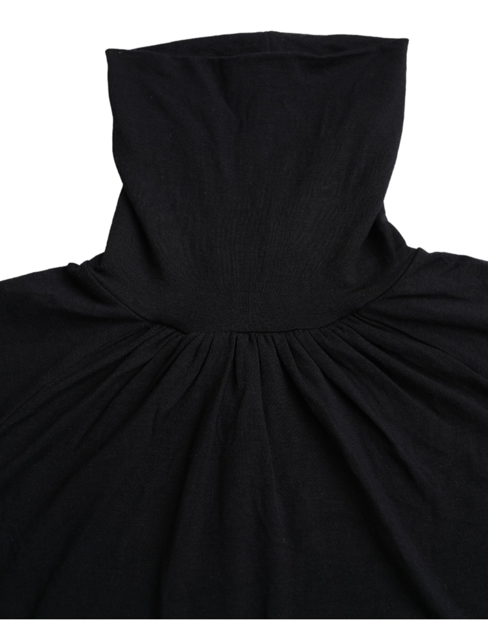 Black hooded garment with ruffled neckline