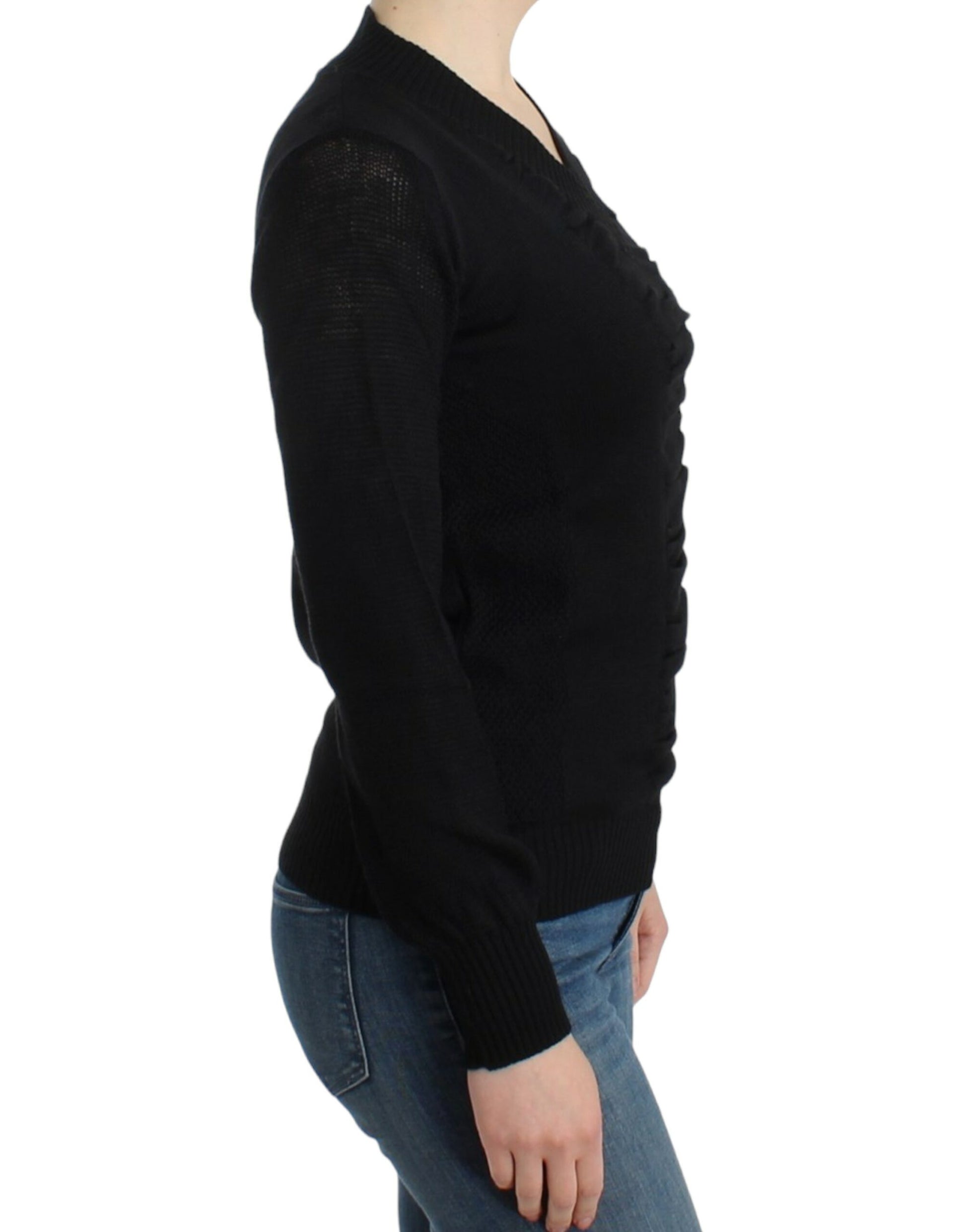 Woman wearing black sweater and blue jeans