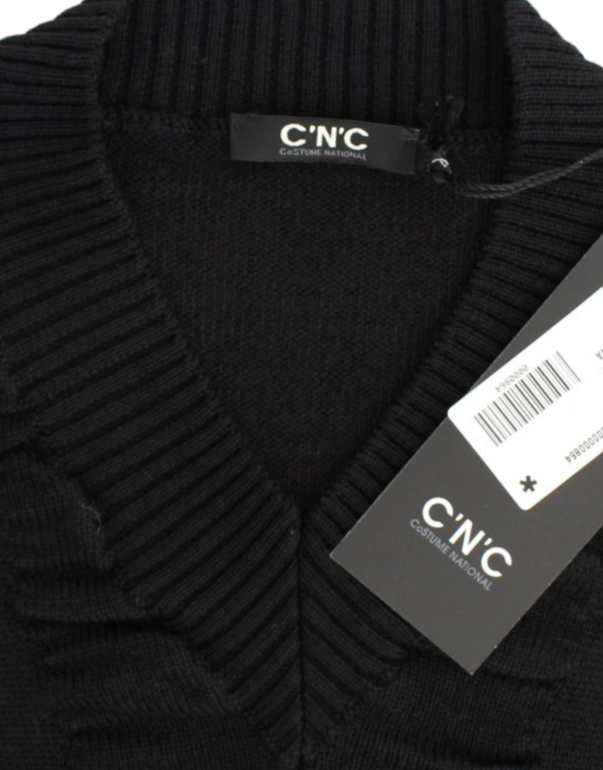 Black knit sweater on hanger