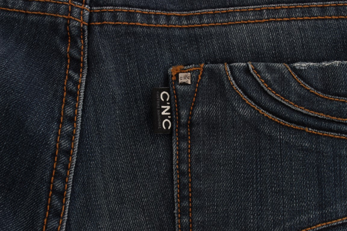 Pair of blue jeans with orange stitching on pocket
