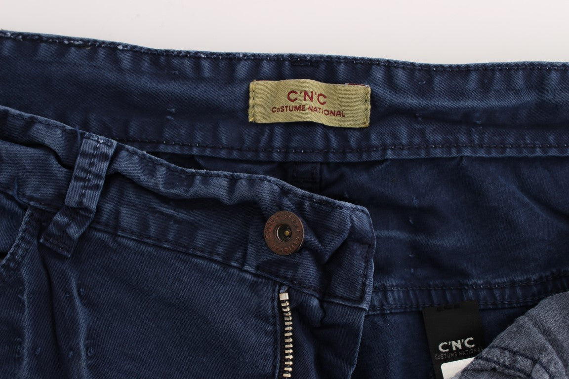 Pair of blue jeans on a bed