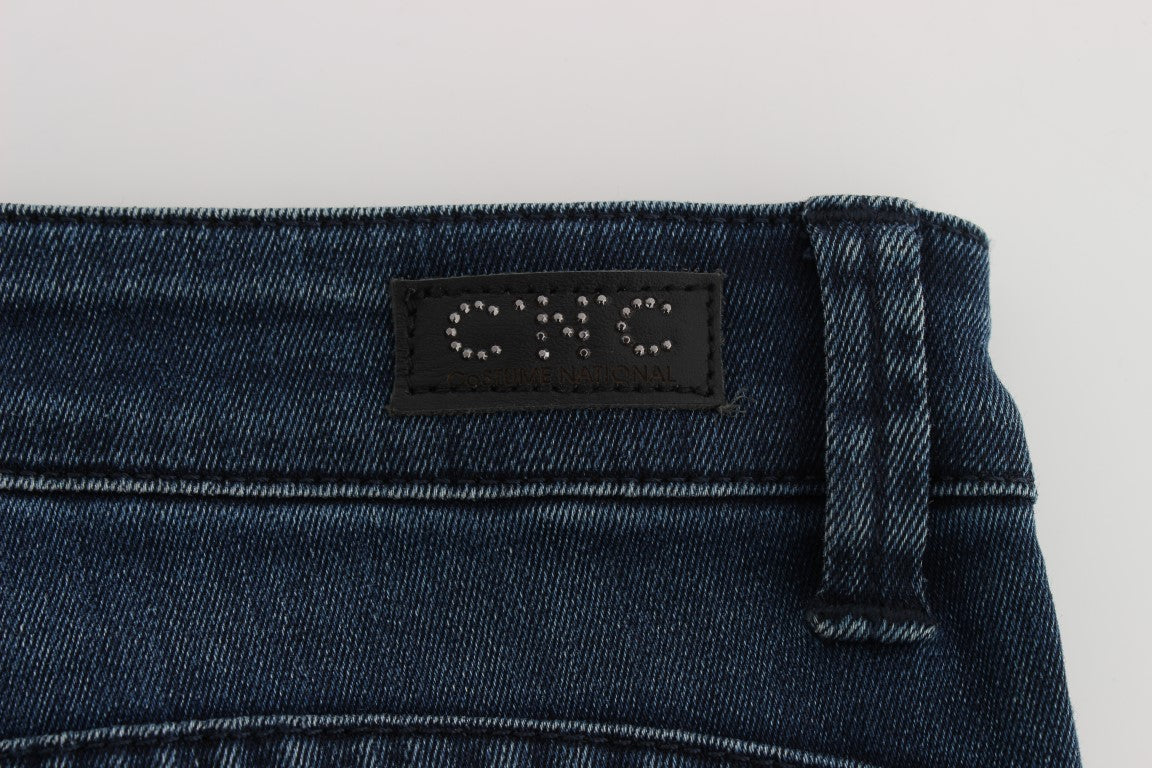 Blue denim jeans with a black label on the waistband