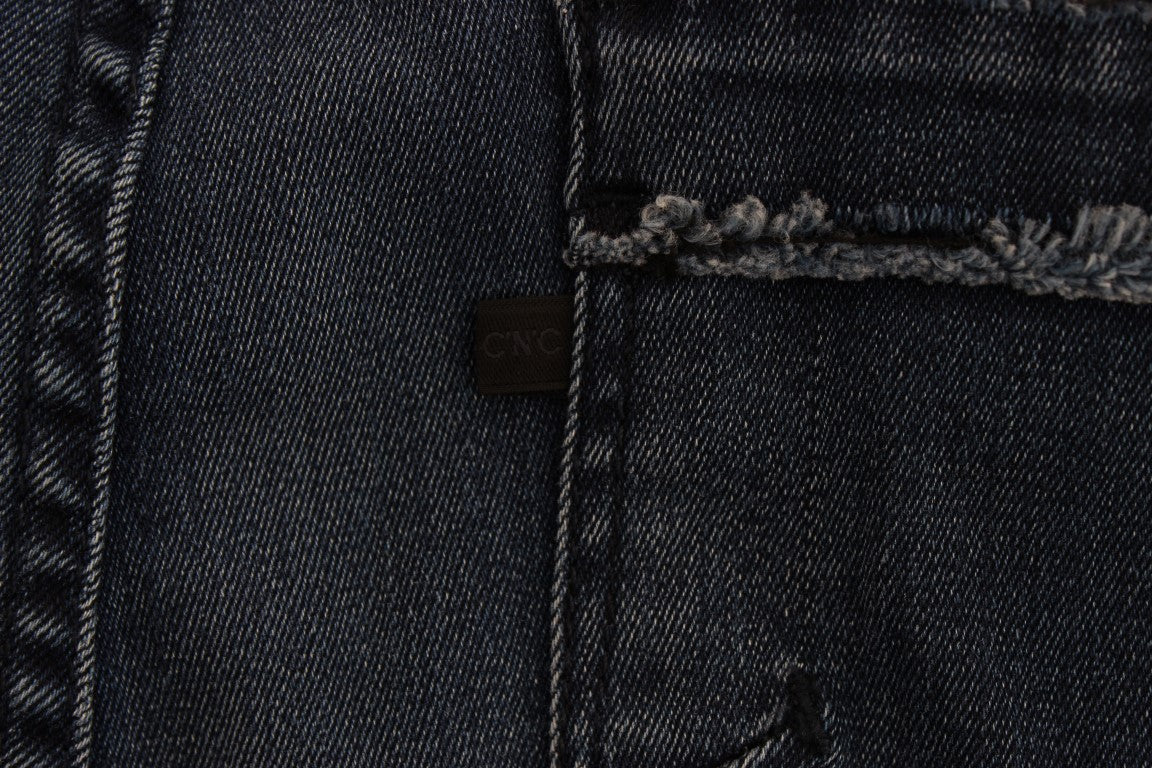 Blue denim jeans with stitched pocket on left leg