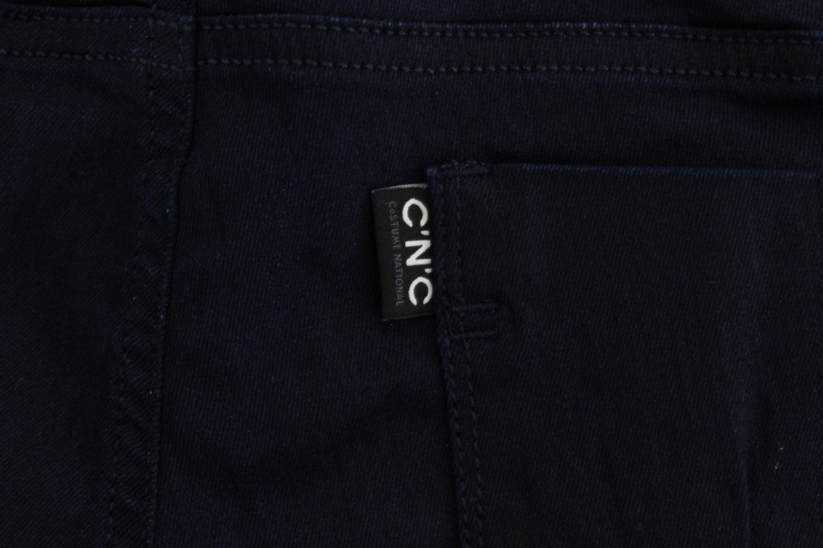 Dark blue denim jeans with a white label on the waistband