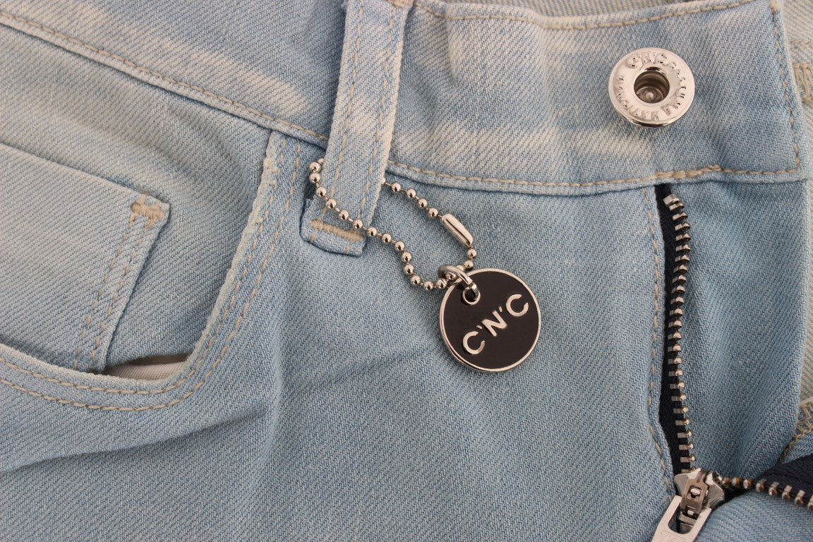 Silver key chain attached to jeans
