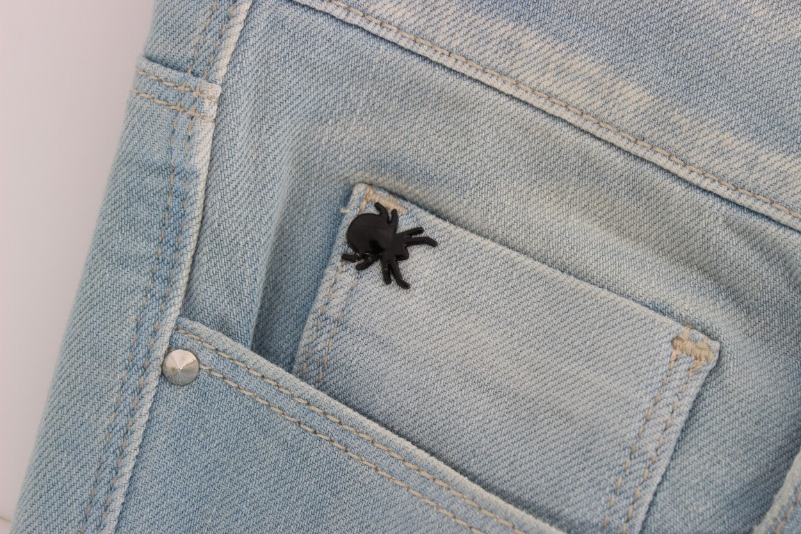Blue denim jeans pocket with black spider embroidery