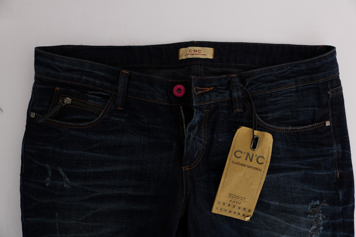 Blue denim jeans with tag attached to waistband