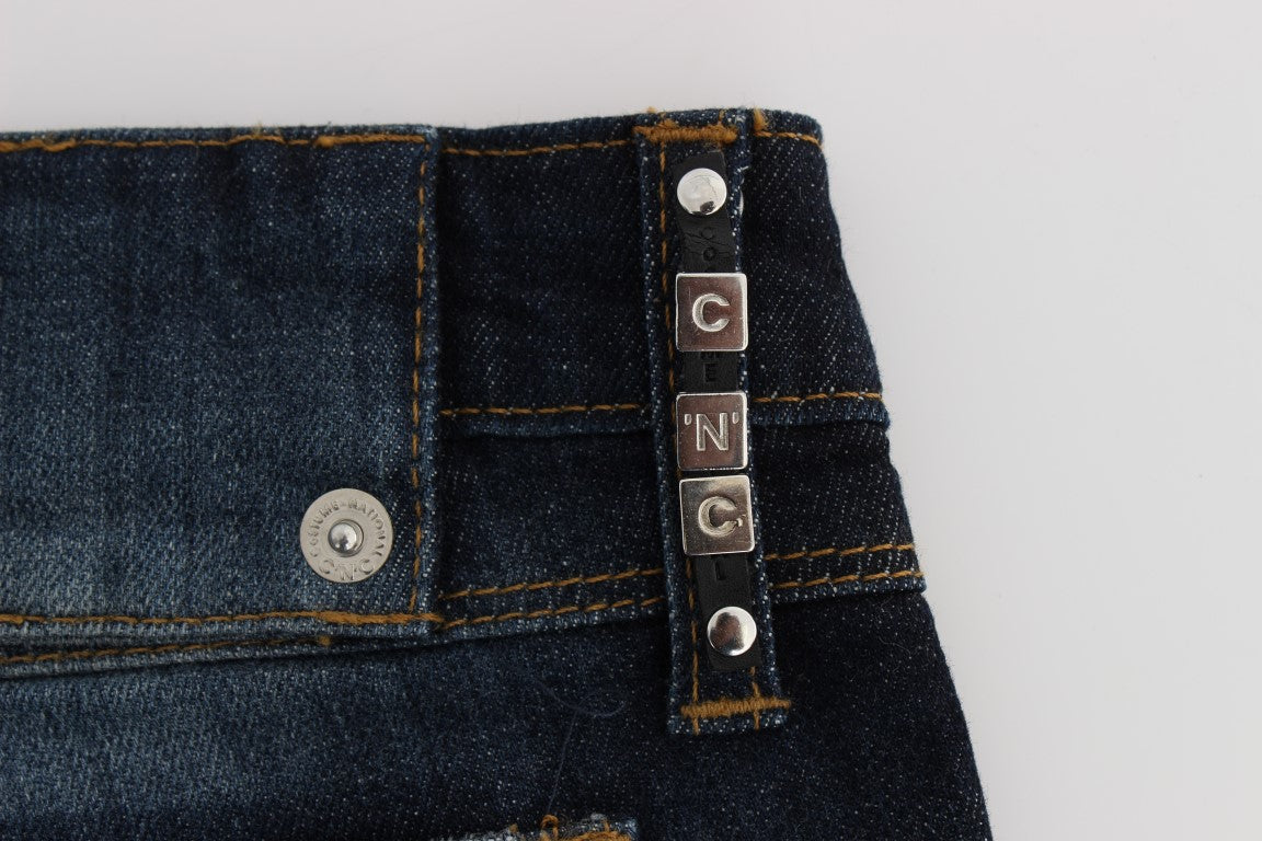 Pair of blue jeans with silver buttons on front pockets