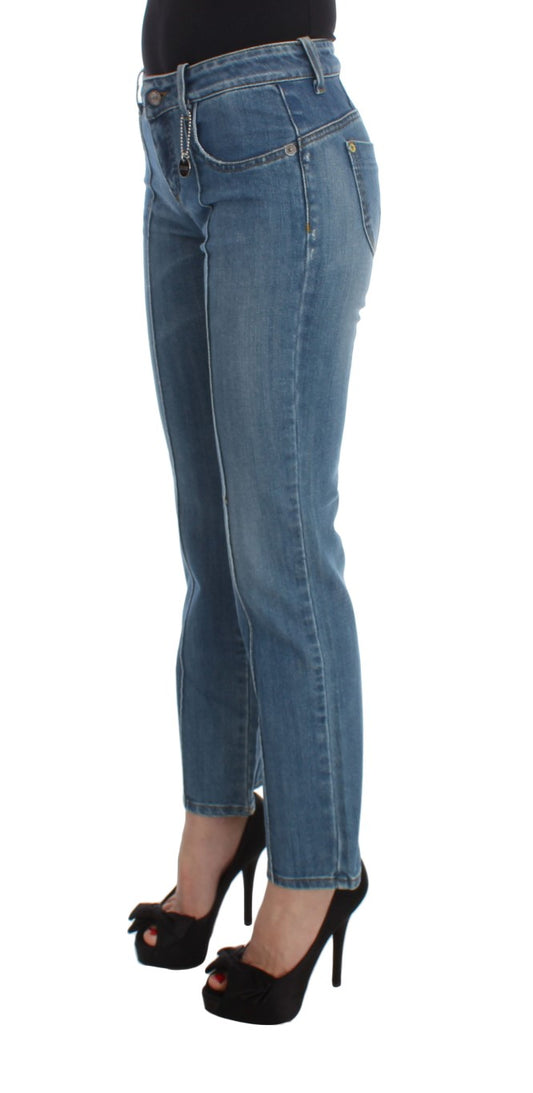 Woman wearing blue jeans and black high heels