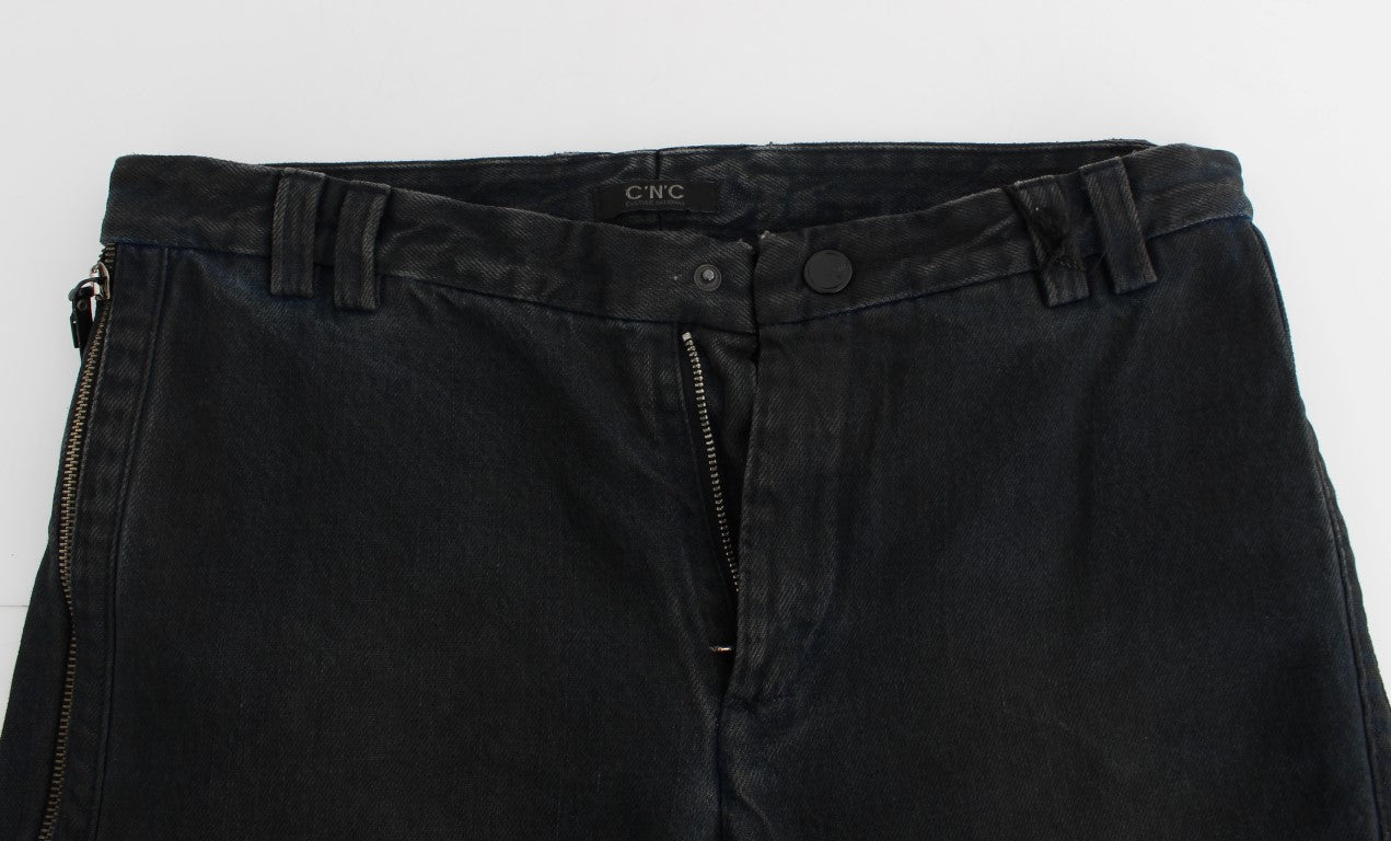 Pair of dark wash jeans with zipper detailing and visible stitching