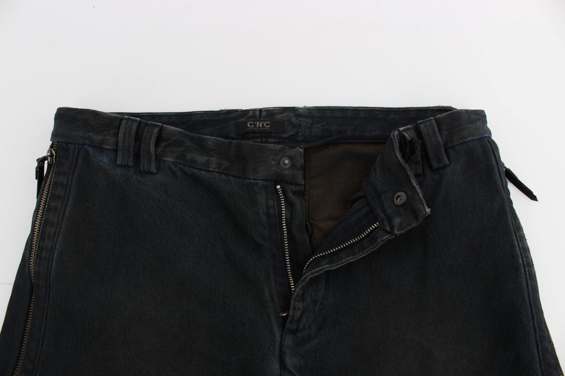 Pair of distressed blue jeans with zipper details and visible stitching