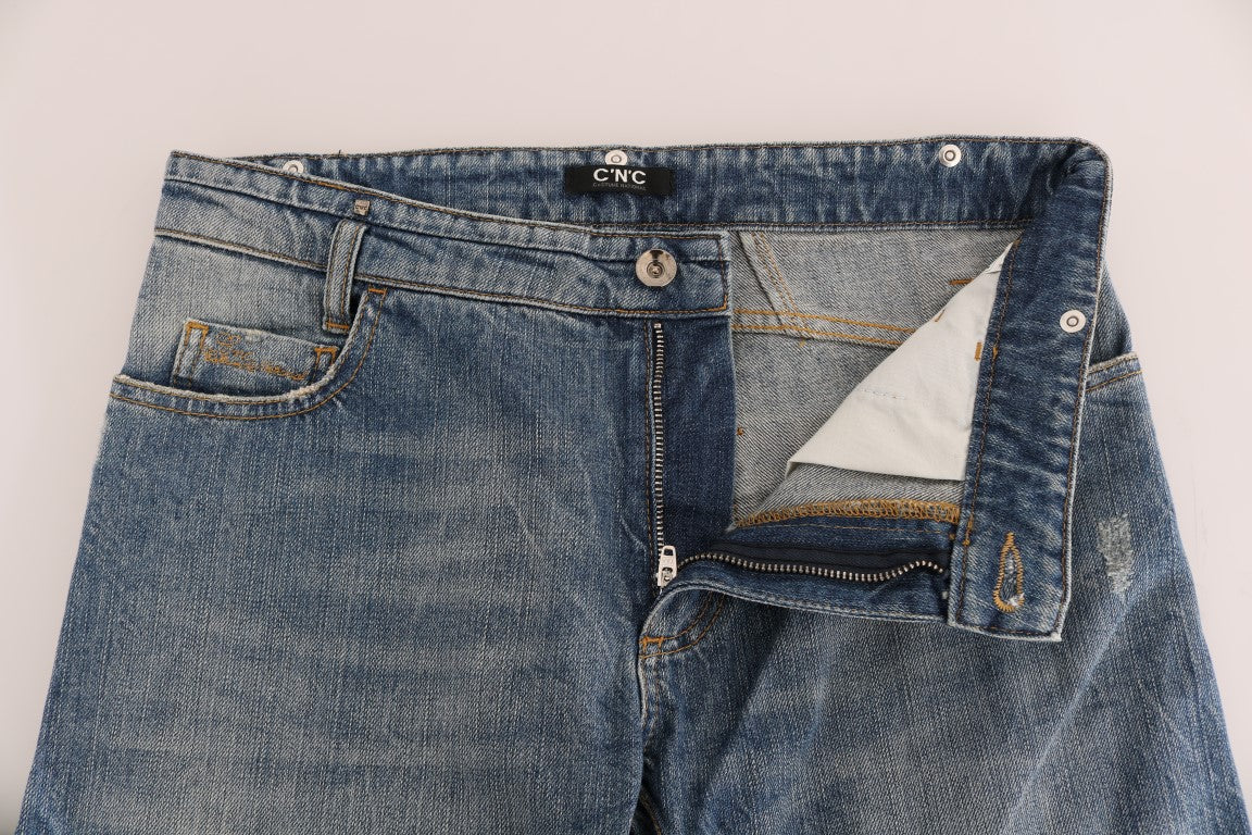 Blue denim jeans on a white surface