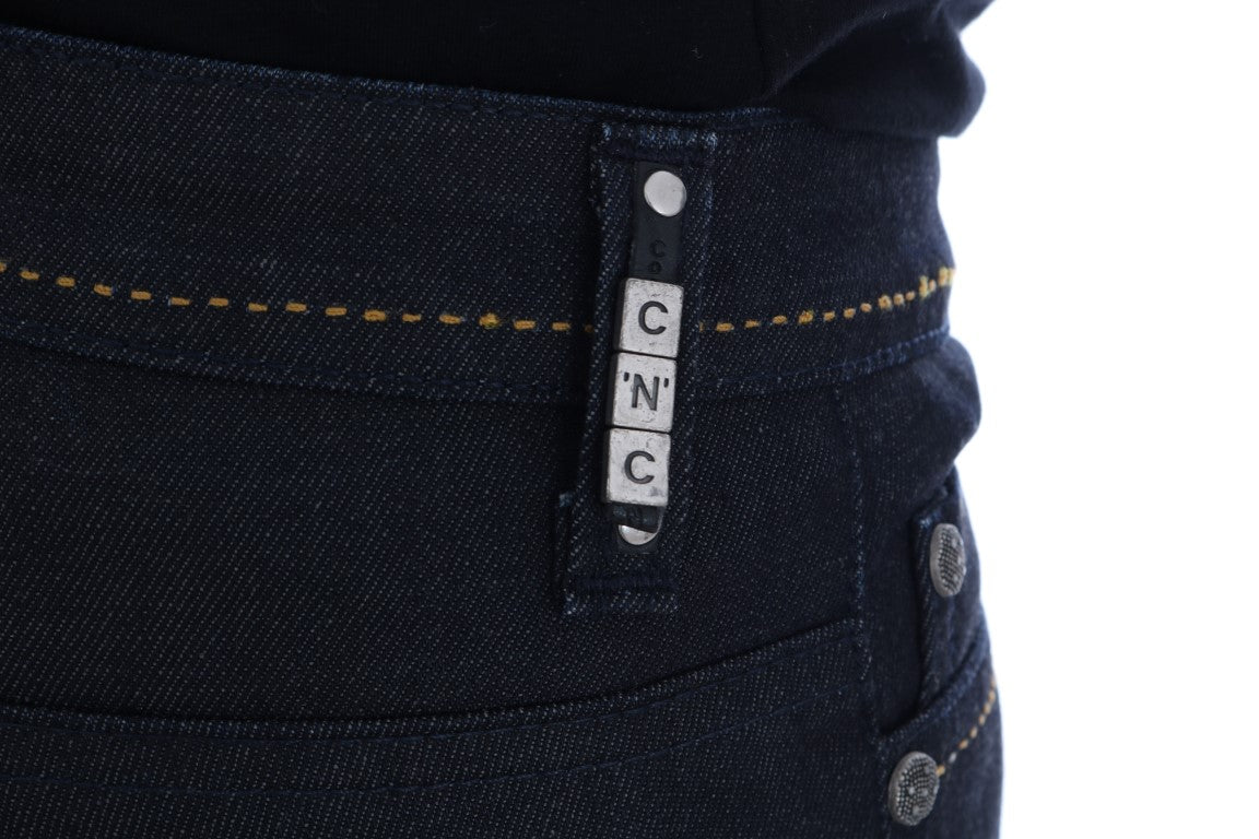 Blue denim jeans with yellow stitching on waistband