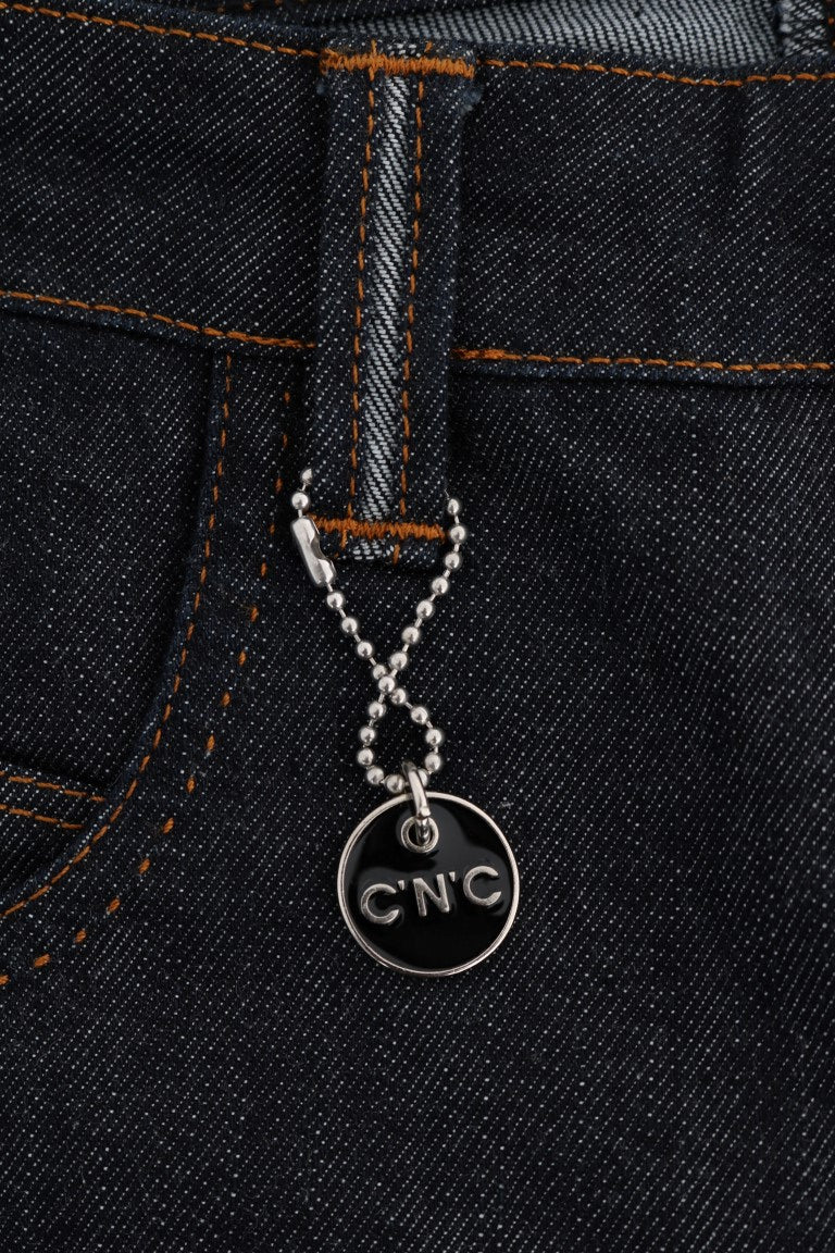 Silver charm on denim jeans